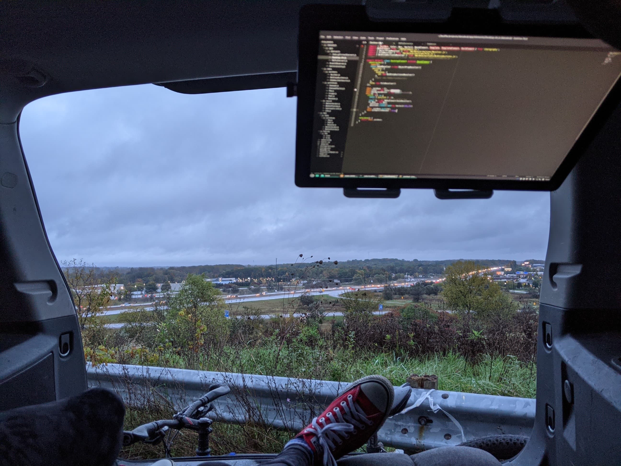 My computing setup in the back of my car in a park off a pretty freeway